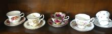 TEN CUPS AND SAUCERS