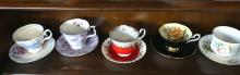 TEN CUPS AND SAUCERS