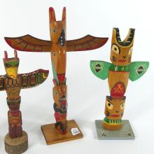CARVED TOTEM POLES