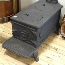 ANTIQUE ACME CAST IRON STOVE