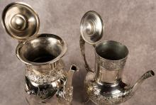 TWO ELABORATE SILVER PLATE COFFEE POTS