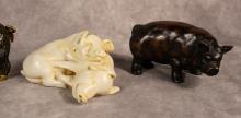 FOUR PIG FIGURINES