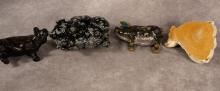 FOUR PIG FIGURINES