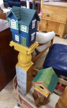 TWO PAINTED BIRDHOUSE STANDS