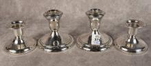 TWO PAIRS OF STERLING CANDLEHOLDERS