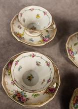 FOUR DRESDEN CUPS AND SAUCERS