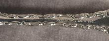 TWELVE STERLING SPOONS
