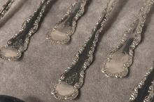 TWELVE STERLING SPOONS