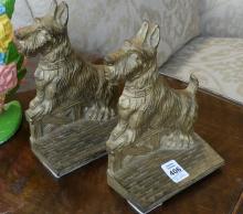 TWO PAIRS OF CAST IRON BOOKENDS