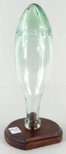 ANTIQUE BOTTLE ON STAND