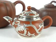 THREE TERRA COTTA TEAPOTS