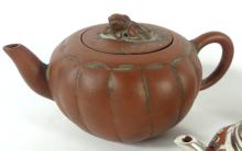 THREE TERRA COTTA TEAPOTS