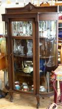 BOW-SIDED CHINA CABINET