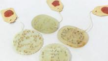 FOUR JADE DISC PENDANTS