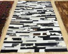 BLACK AND WHITE COWHIDE RUG