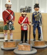 THREE FOLK ART WOODEN "SOLDIER" CARVINGS