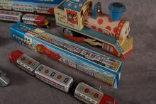 5 TIN TOY TRAINS