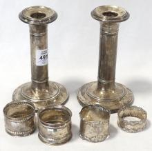 STERLING CANDLESTICKS AND NAPKIN RINGS