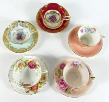 FIVE CUPS AND SAUCERS