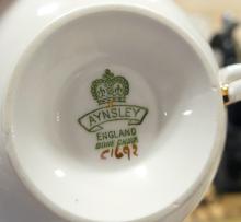 SIX AYNSLEY CUPS AND SAUCERS