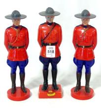 THREE "MOUNTIE" FIGURINES