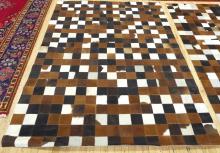 PAIR OF "CHECKERBOARD" COWHIDE RUGS