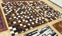 PAIR OF "CHECKERBOARD" COWHIDE RUGS