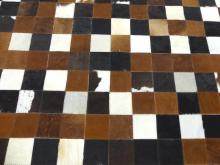 PAIR OF "CHECKERBOARD" COWHIDE RUGS