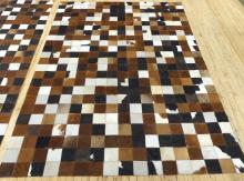 PAIR OF "CHECKERBOARD" COWHIDE RUGS