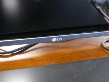 LG FLATSCREEN TELEVISION AND DVD PLAYER