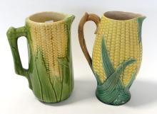 TWO MAJOLICA POTTERY "CORN" PITCHERS