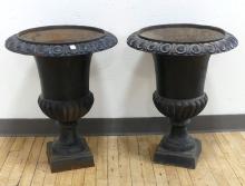 PAIR OF CAST IRON GARDEN URNS