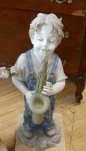 PAIR OF RESIN "CHILD MUSICIAN" SCULPTURES