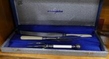 TWO CARVING SETS