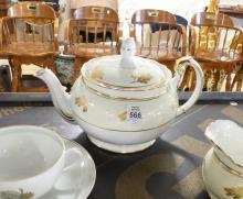 TEAPOT, CREAMER, CUPS AND SAUCERS