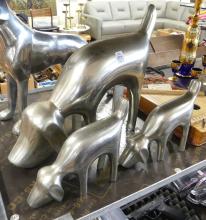 FOUR ALUMINUM "DOG" SCULPTURES