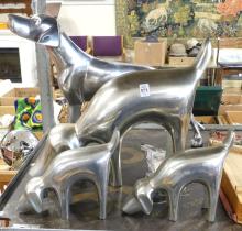 FOUR ALUMINUM "DOG" SCULPTURES