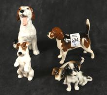 FOUR "DOG" FIGURINES