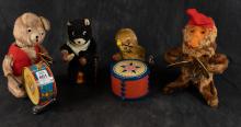 FOUR VINTAGE WIND-UP TOYS