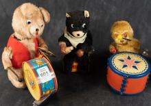 FOUR VINTAGE WIND-UP TOYS