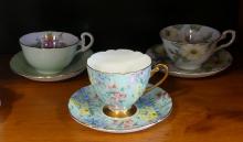 SIX ENGLISH CUPS AND SAUCERS