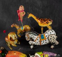 SEVEN TIN WIND-UP TOYS