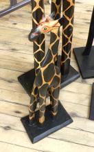 FOUR WOODEN "GIRAFFE" CARVINGS