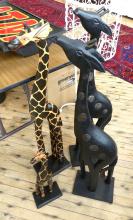 FOUR WOODEN "GIRAFFE" CARVINGS