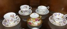 TWELVE CUPS AND SAUCERS
