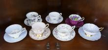 TWELVE CUPS AND SAUCERS