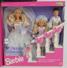 3 BARBIES IN BOXES