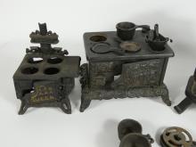 4 TOY CAST IRON STOVES