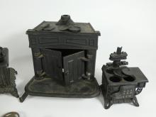 4 TOY CAST IRON STOVES