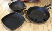 FIVE CAST IRON FRYING PANS